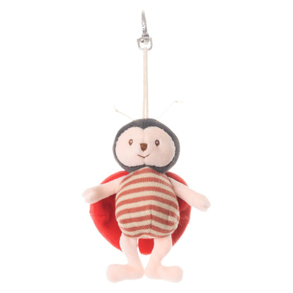 front view  of ladybug plush bag charm shown on a white background