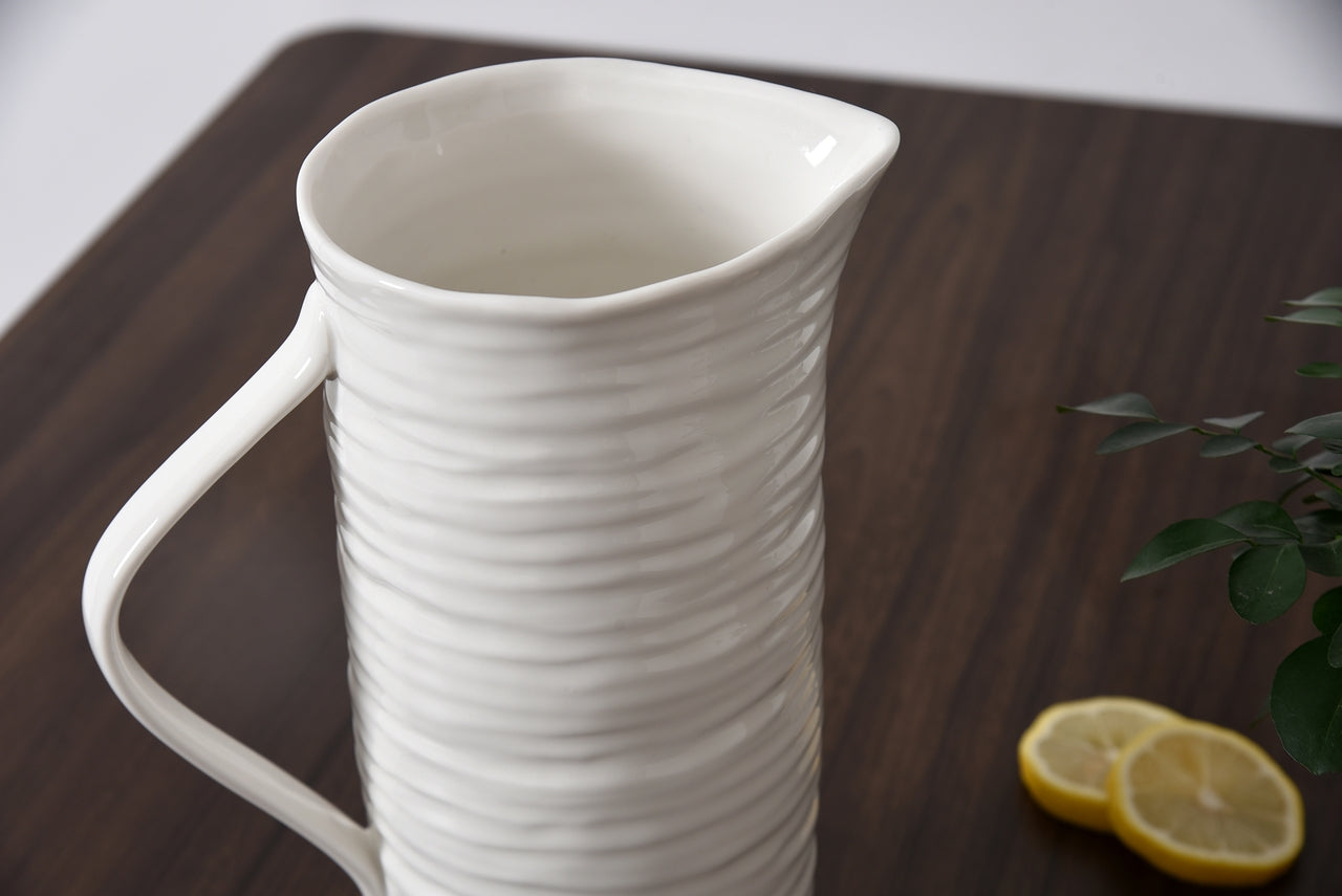 white ceramic pitcher on a table