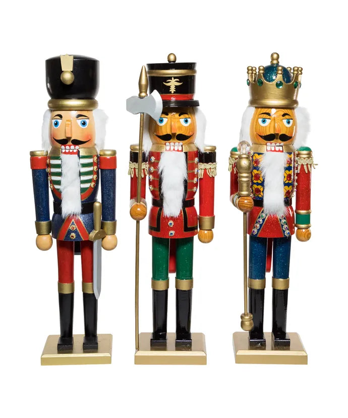 3 nutcrackers in a row on a white background.