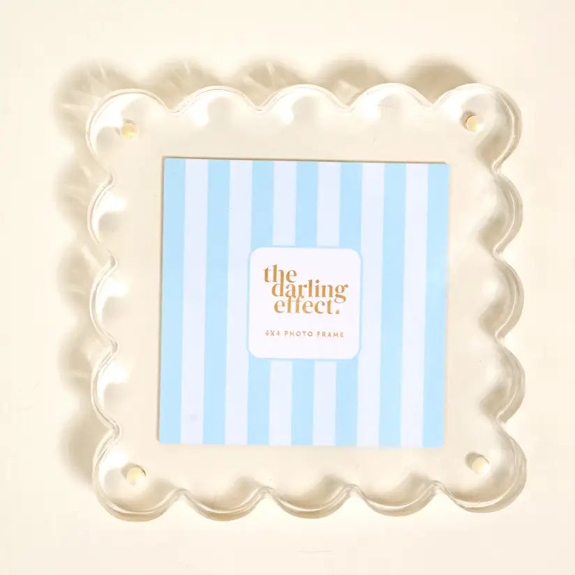 clear Square Acrylic Frame with blue striped paper in it shown on a light beige background