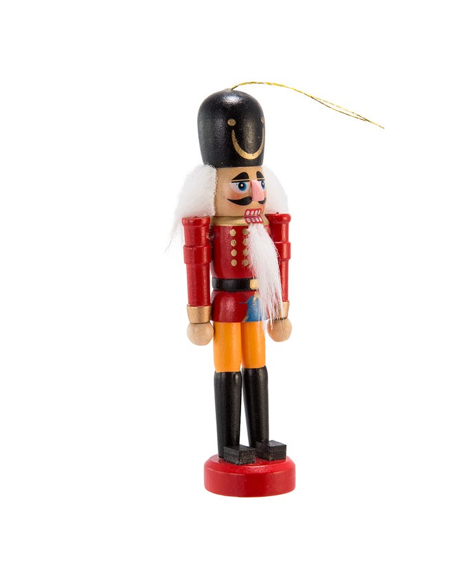 red with black hat soldier wooden nutcracker ornament displayed on a white background