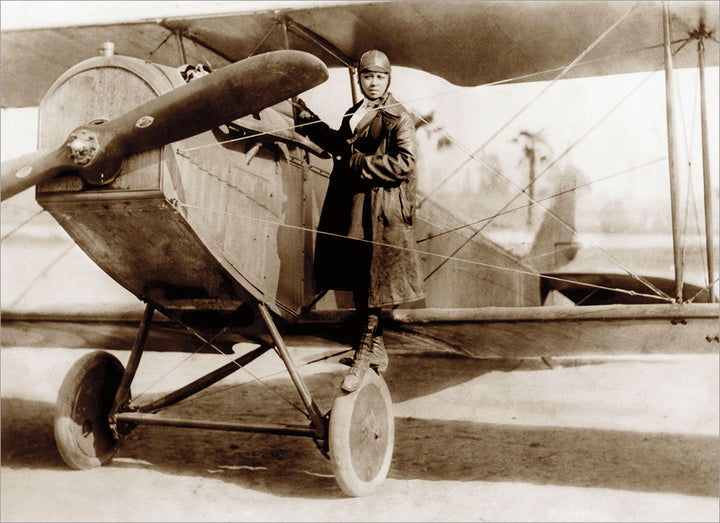 front of card has old black and white photo of bessie colman standing on the tire of a airplane