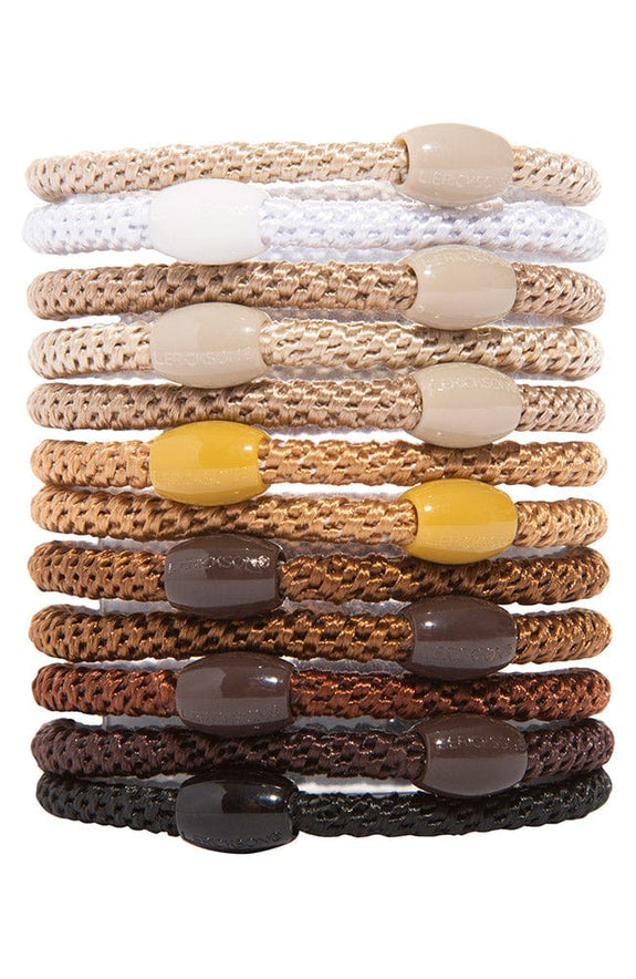 stack of camelback ponytail holders each with coordinating oval bead on a white background.