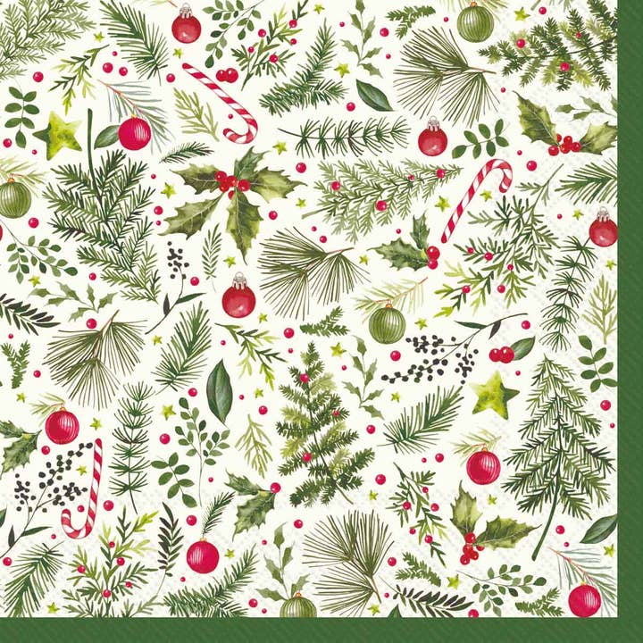 A Christmas paper napkin featuring green pine branches, holly leaves, red berries, candy canes, ornaments, and stars on a white background, with a dark green border.