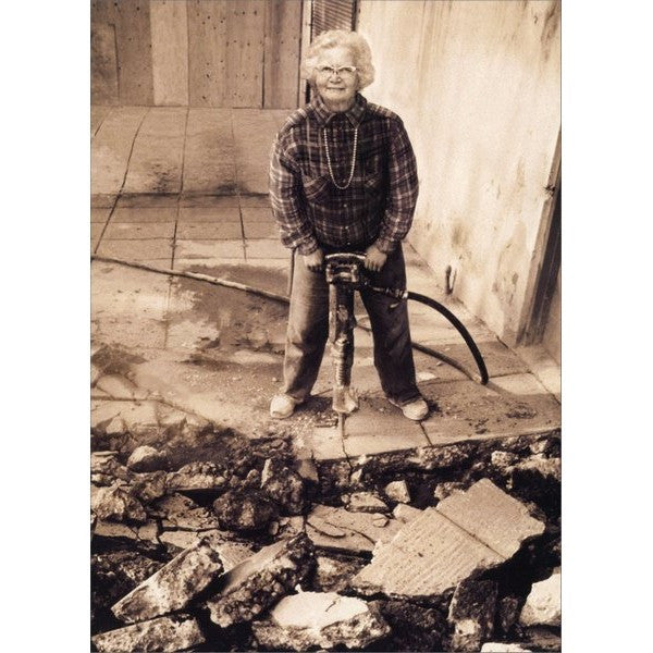 front of card has a black and white picture of an older lady with a jackhammer 