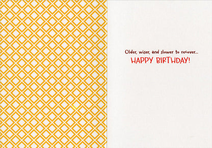 inside of card with left side printed with yellow geometer pattern and right side with text.
