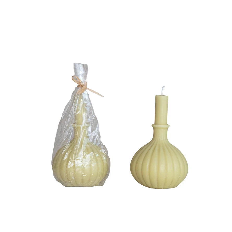 2 cream colored vase shape candles, one is in its packaging bag with a twine bow.