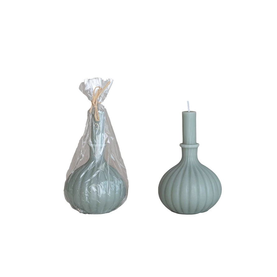 2 vase shaped taper candles, on e in a packaging bag tied with twine.