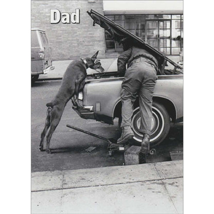 front of card with black and white image of man and dog leaning under an open car hood