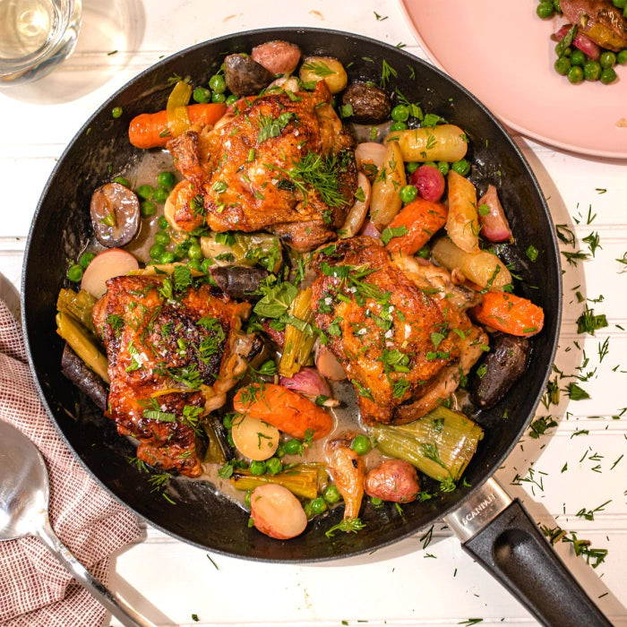 top view of 12 inch frypan filled with cooked meat and veggies