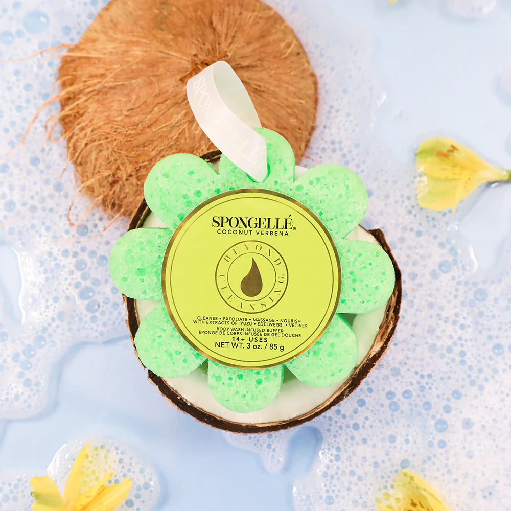 Green flower-shaped sponge with a yellow label on a blue background