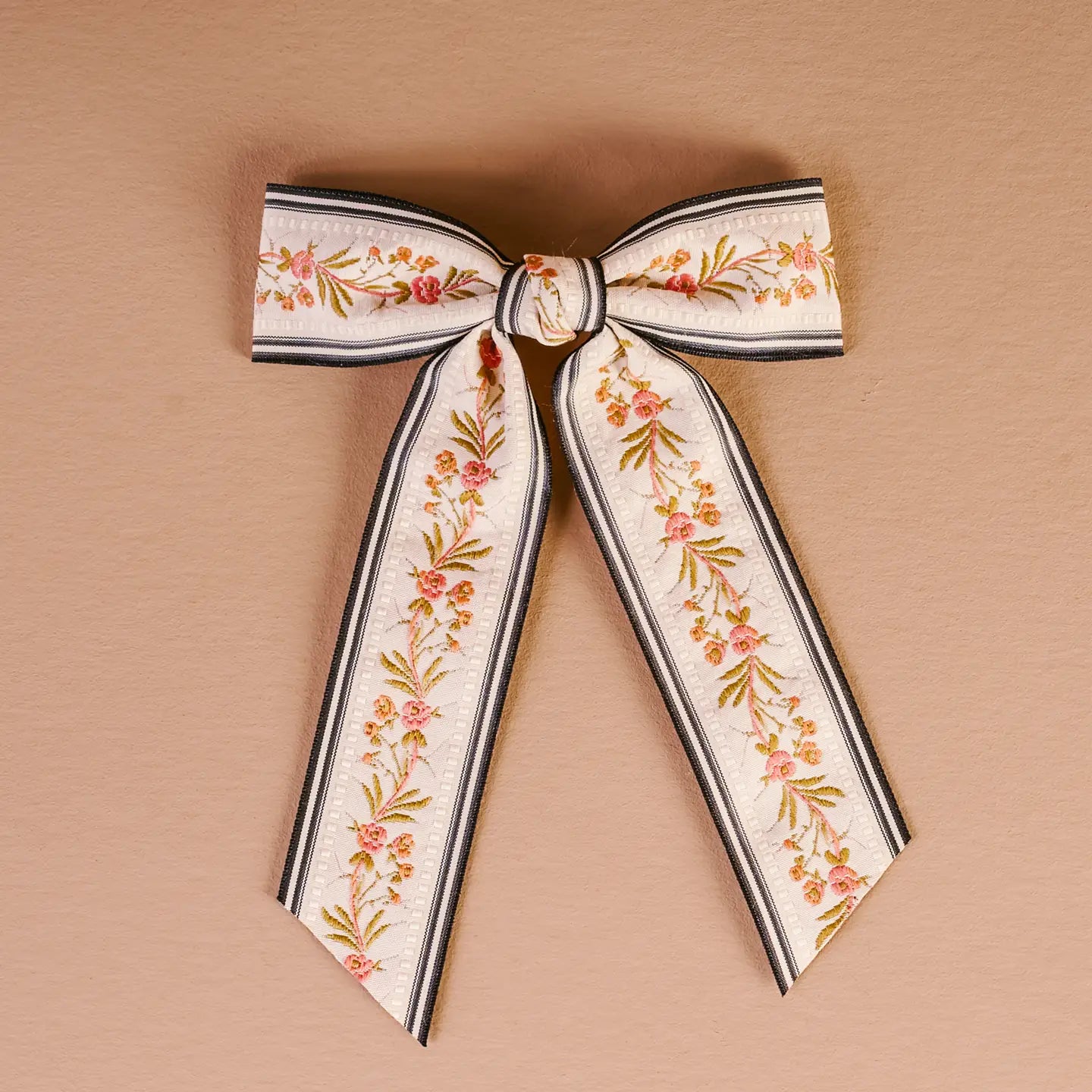 cream Cottage Crush Hair Bow shown on a beige background
