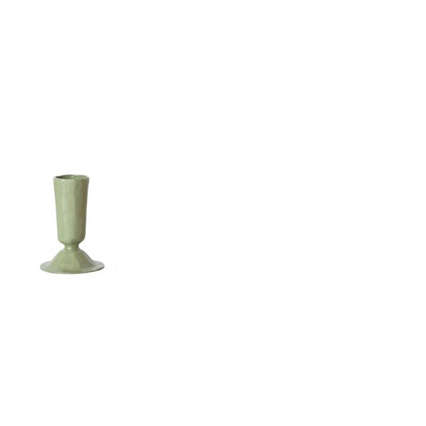 small Green taper candle holder on a white background
