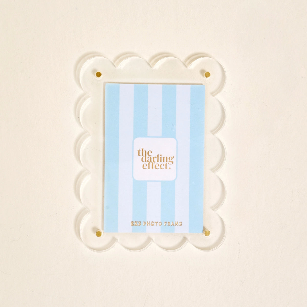 Scalloped clear magnetic frame against a white background.