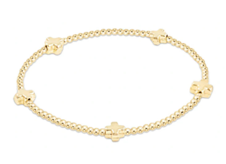 gold beaded bracelet with gold cross beads