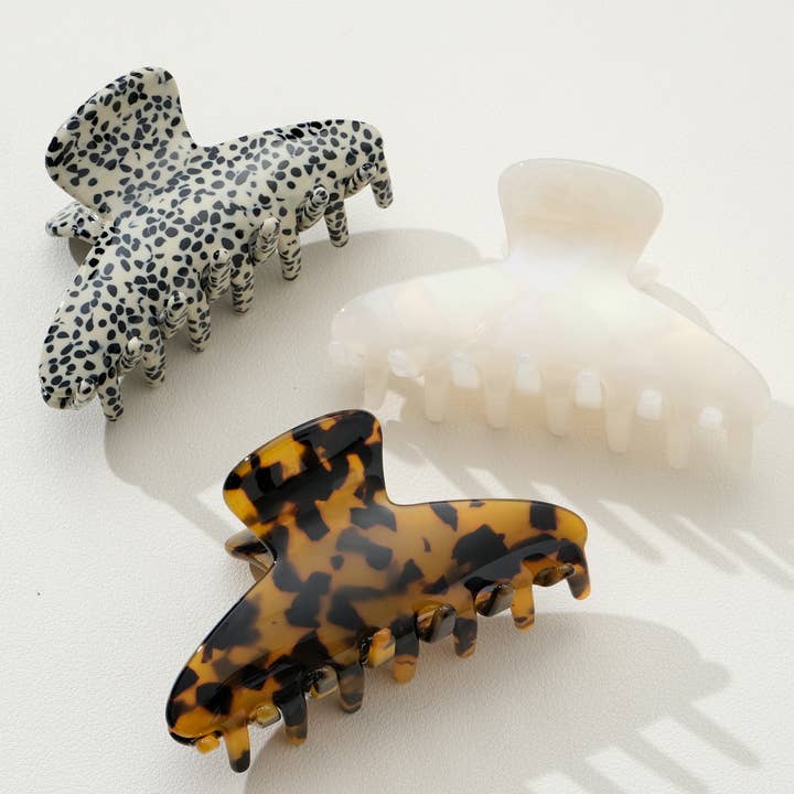 3 assorted claw clips on a white background