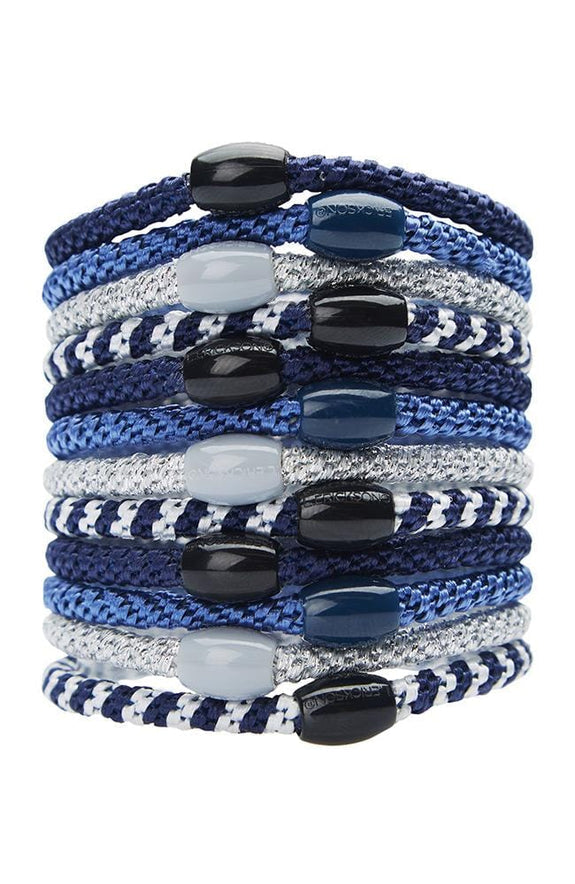 stack of denim ponytail holders each with coordinating oval bead on a white background.