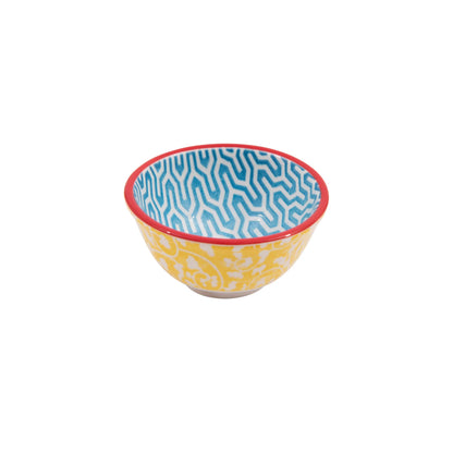 pinch bowl with yellow floral pattern outside and blue geometric pattern inside.