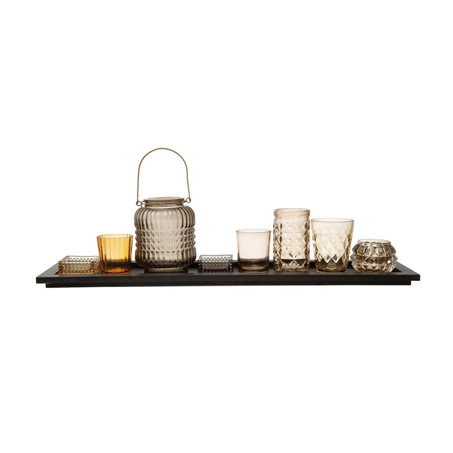 embossed glass tealight holders with black wood tray displayed against a white backgroudn