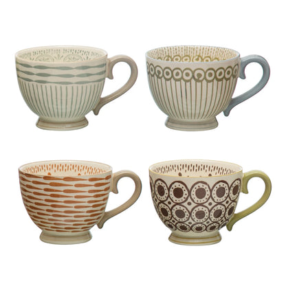 all four patterns of stoneware mugs displayed against a white background