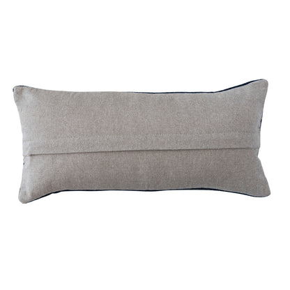 back view of pillow with solid tan backing and zipper opening