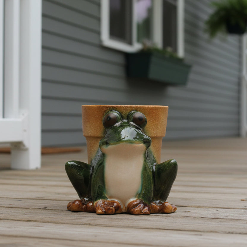 frog planter sitting on a front porch