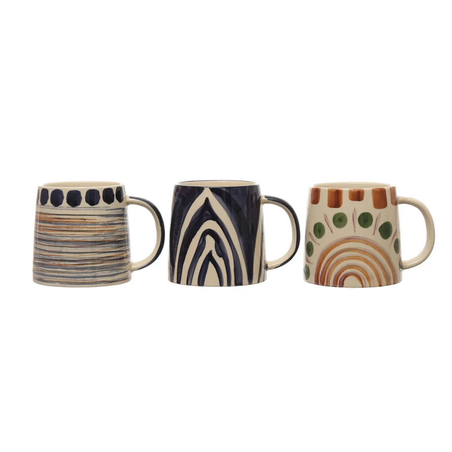 all three styles of hand painted stoneware mugs displayed against a white background