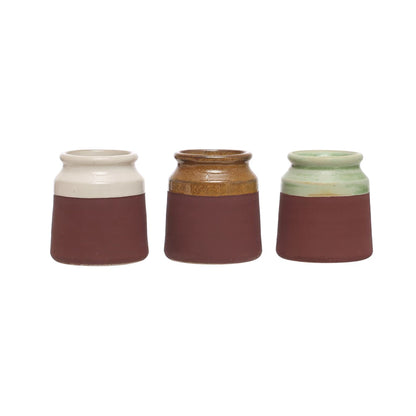 all three colors of stoneware match holder with striker displayed against a white background