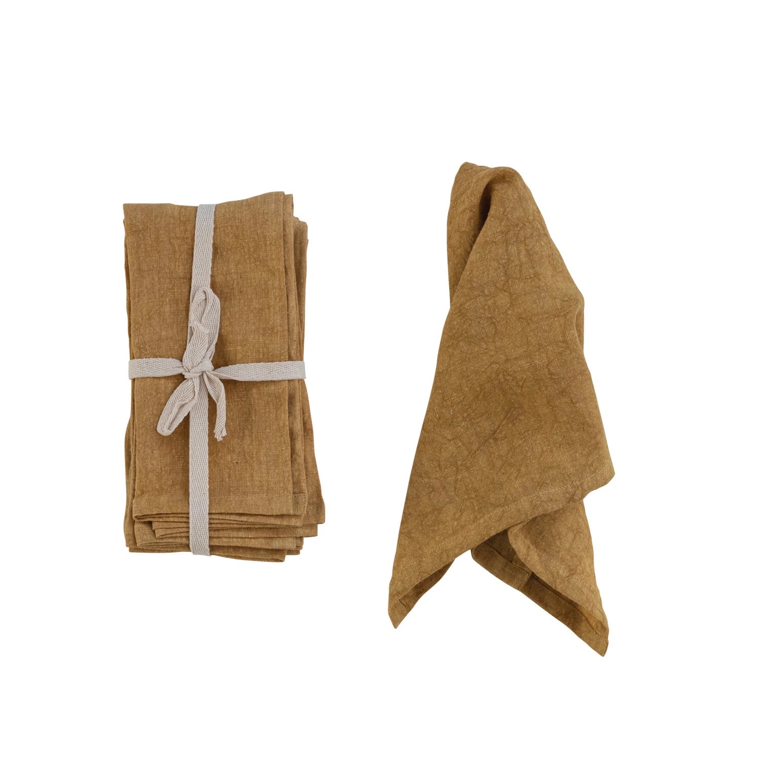 set of folded gold Stonewashed Linen Napkins tied with ribbon and one displayed draped over itself on a white background
