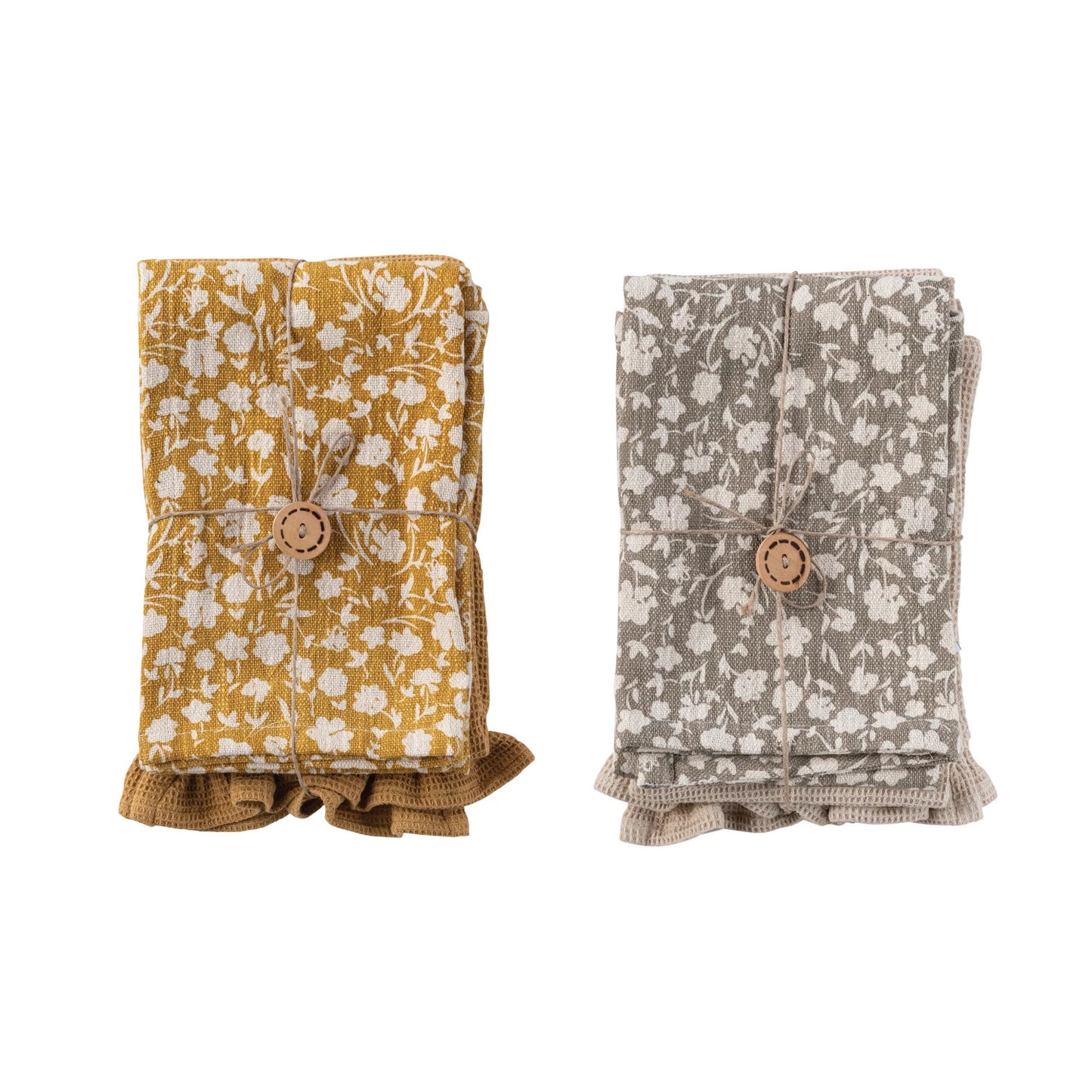 both styles of floral printed cotton waffle tea towels folded and displayed against a white background