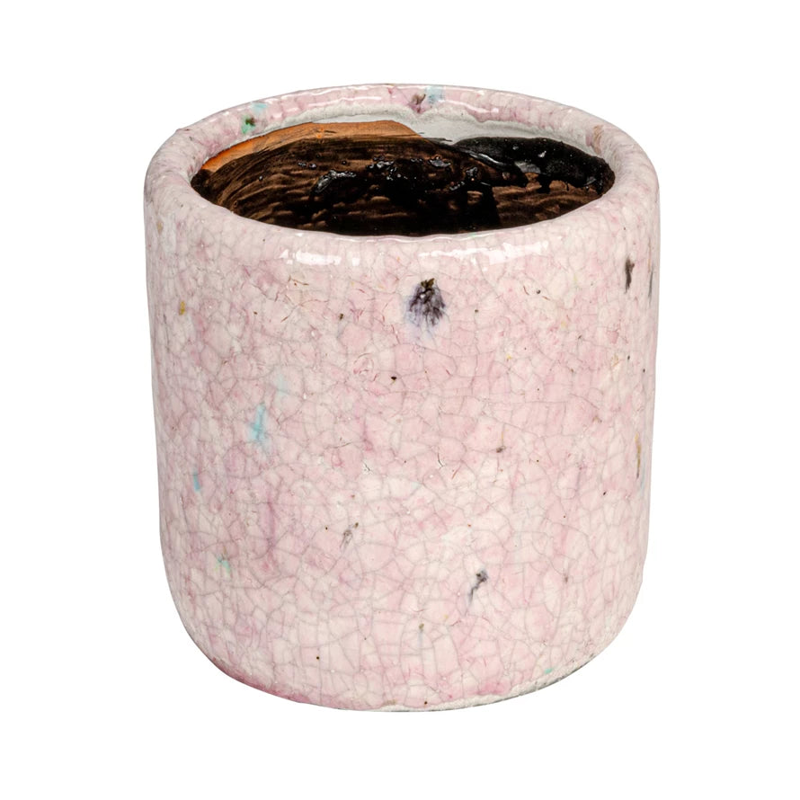 side view of large pink planter shown on a white background