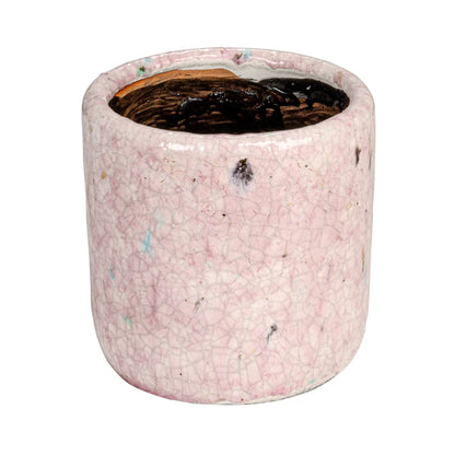 side view of large pink planter shown on a white background