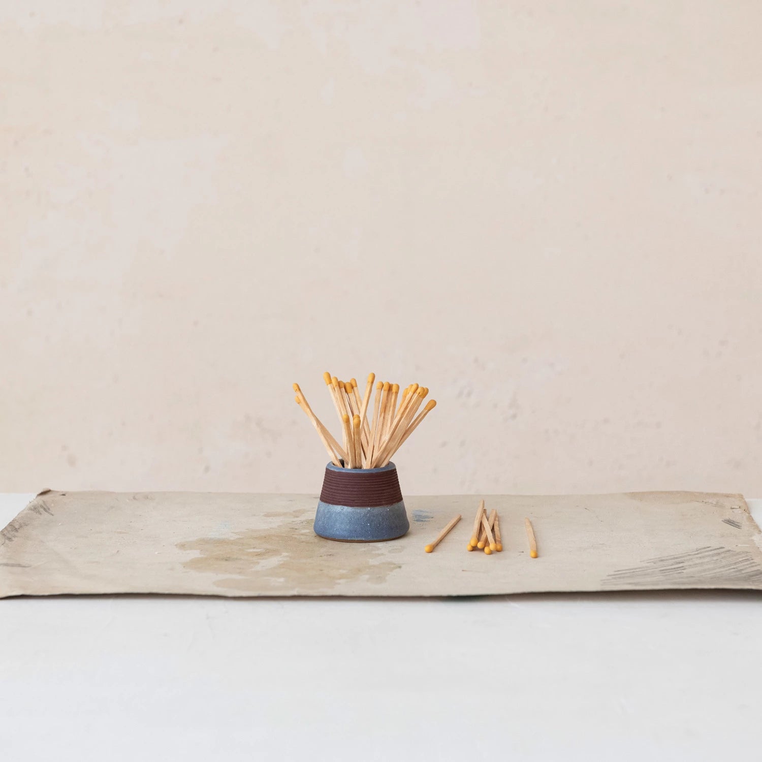 blue matchholder holding matches