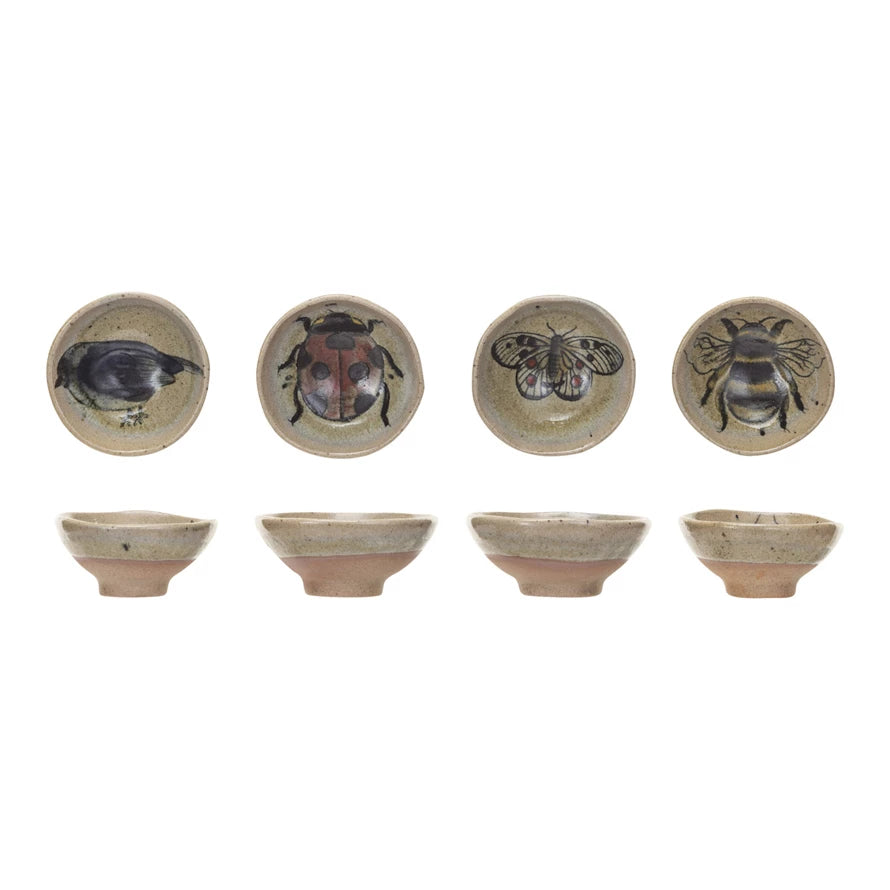 top and side views of 4 styles of insect and bird dishes in row on a white background