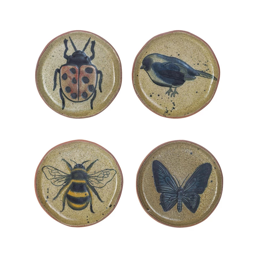 4 stoneware plates with images of insects or a bird painted on it