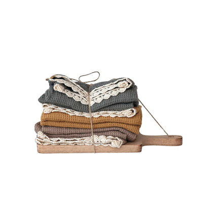 tea towels folded and tied to the board