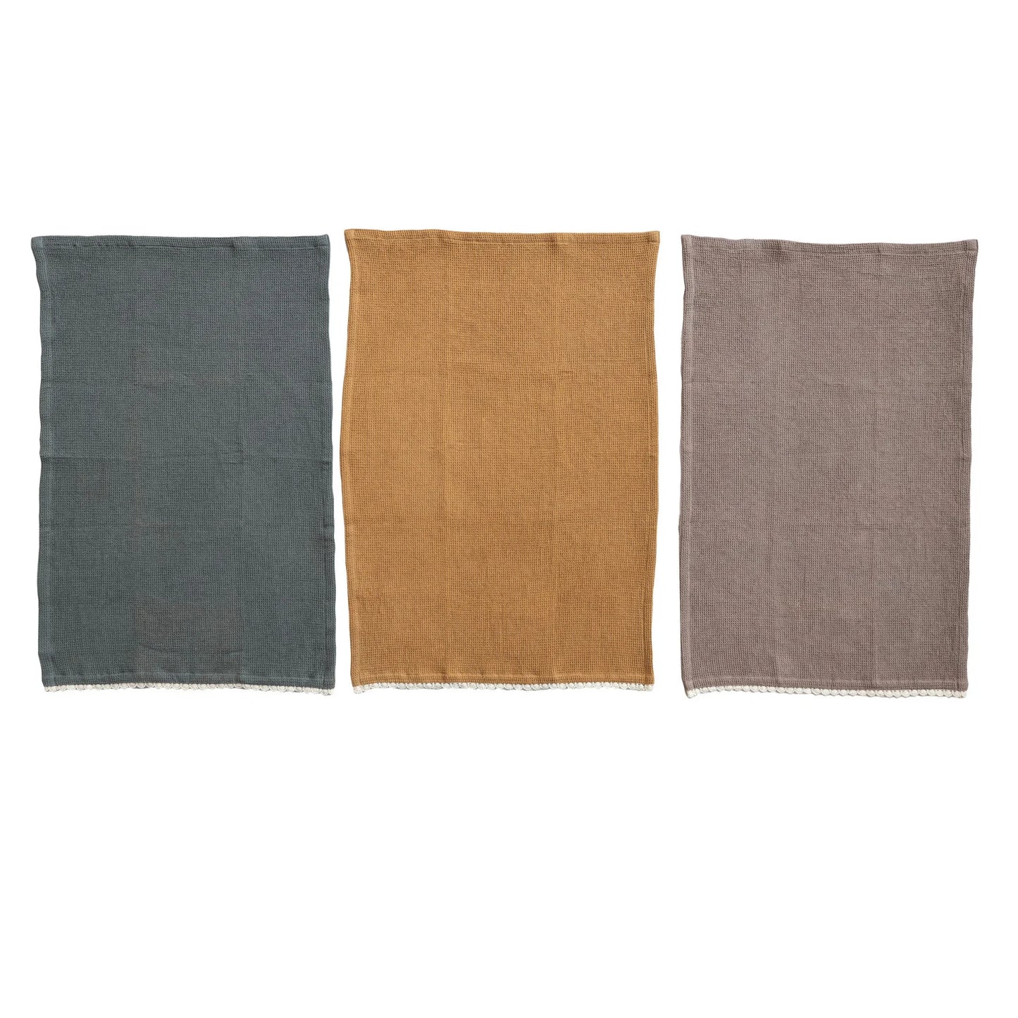 blue/grey tea towel, mustard tea towel, and a taupe tea towel on a white background