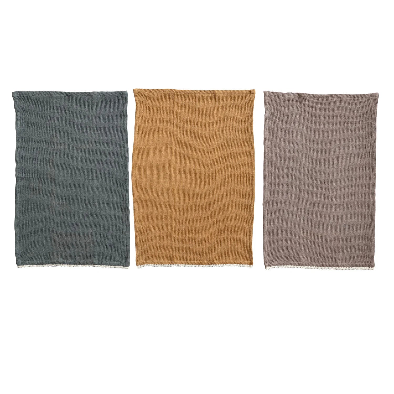 blue/grey tea towel, mustard tea towel, and a taupe tea towel on a white background