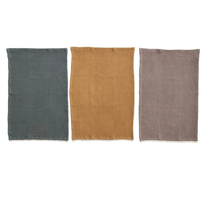 blue/grey tea towel, mustard tea towel, and a taupe tea towel on a white background