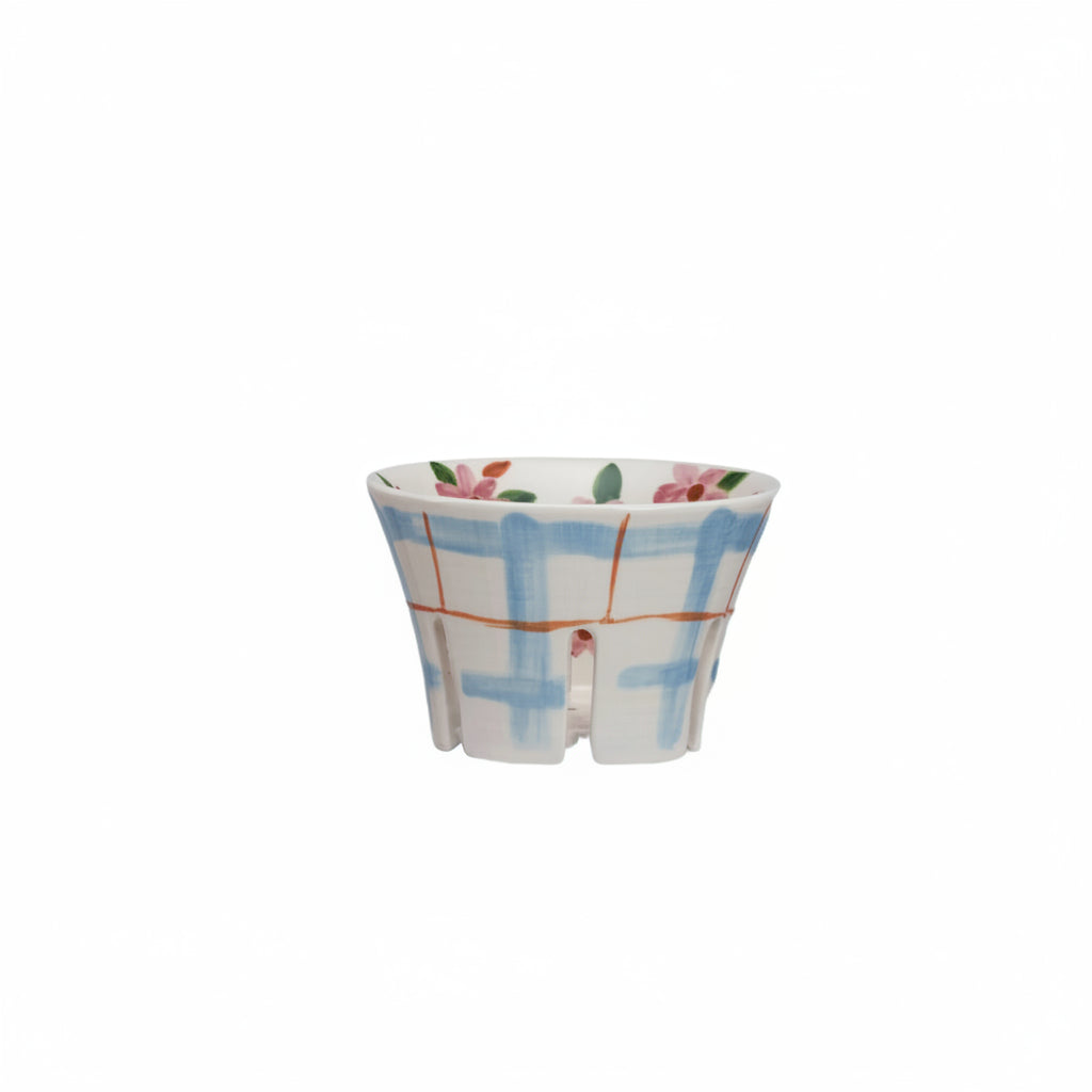 ceramic berry bowl with blue plaid exterior and pink floral interior