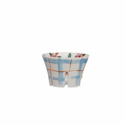 ceramic berry bowl with blue plaid exterior and pink floral interior