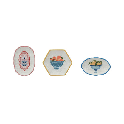 3 style of little dishes in a row on a white background