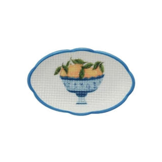 small oval dish with blue rim and blue bowl filled with lemon design in the center