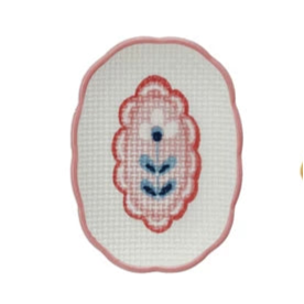 small oval dish with pink rim and pink flower design