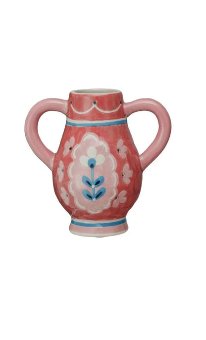 small red handled urn with pink flowers painted on it.