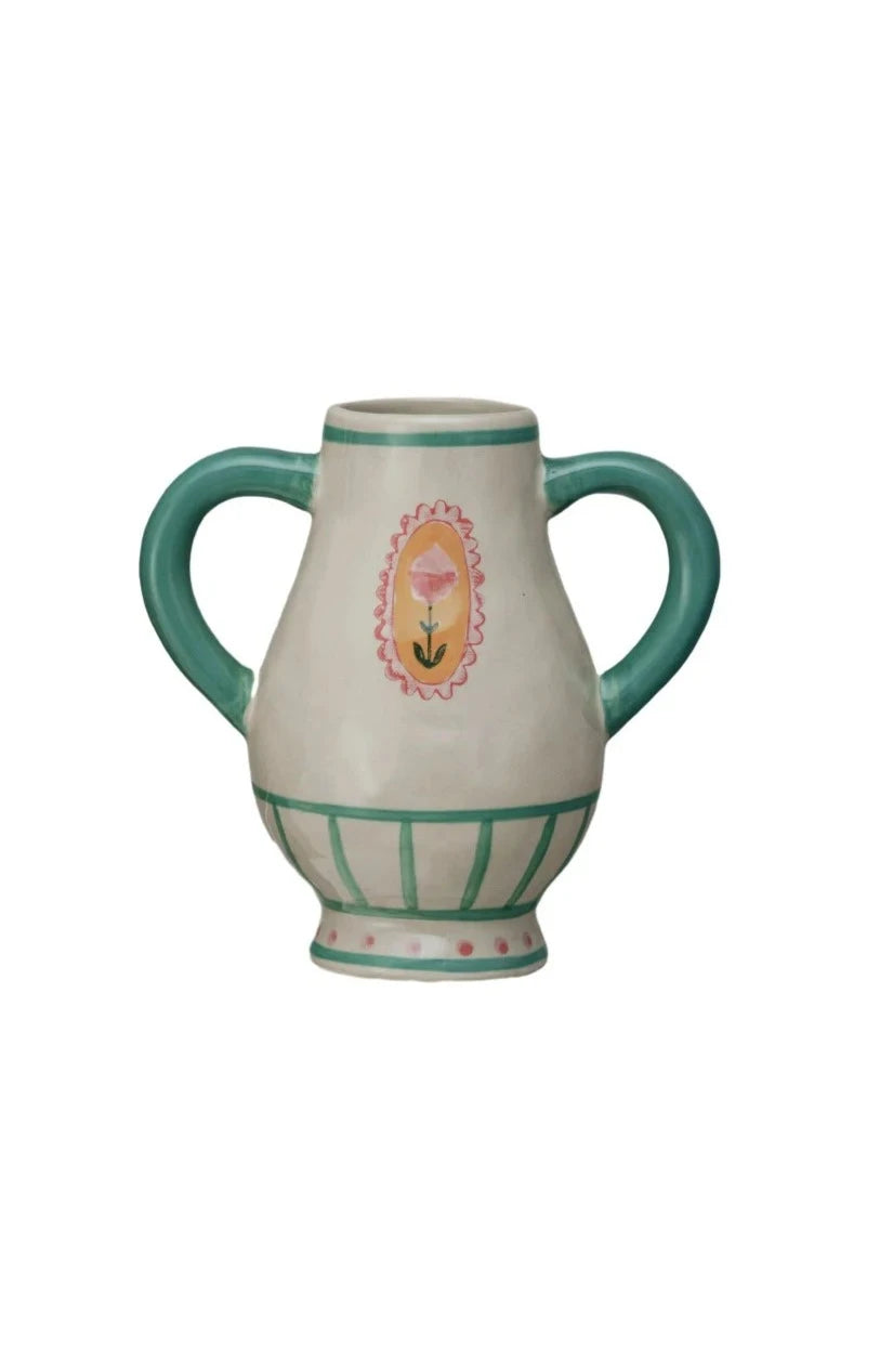 small off-white handled urn wit green stripes and pink flower painted on it.