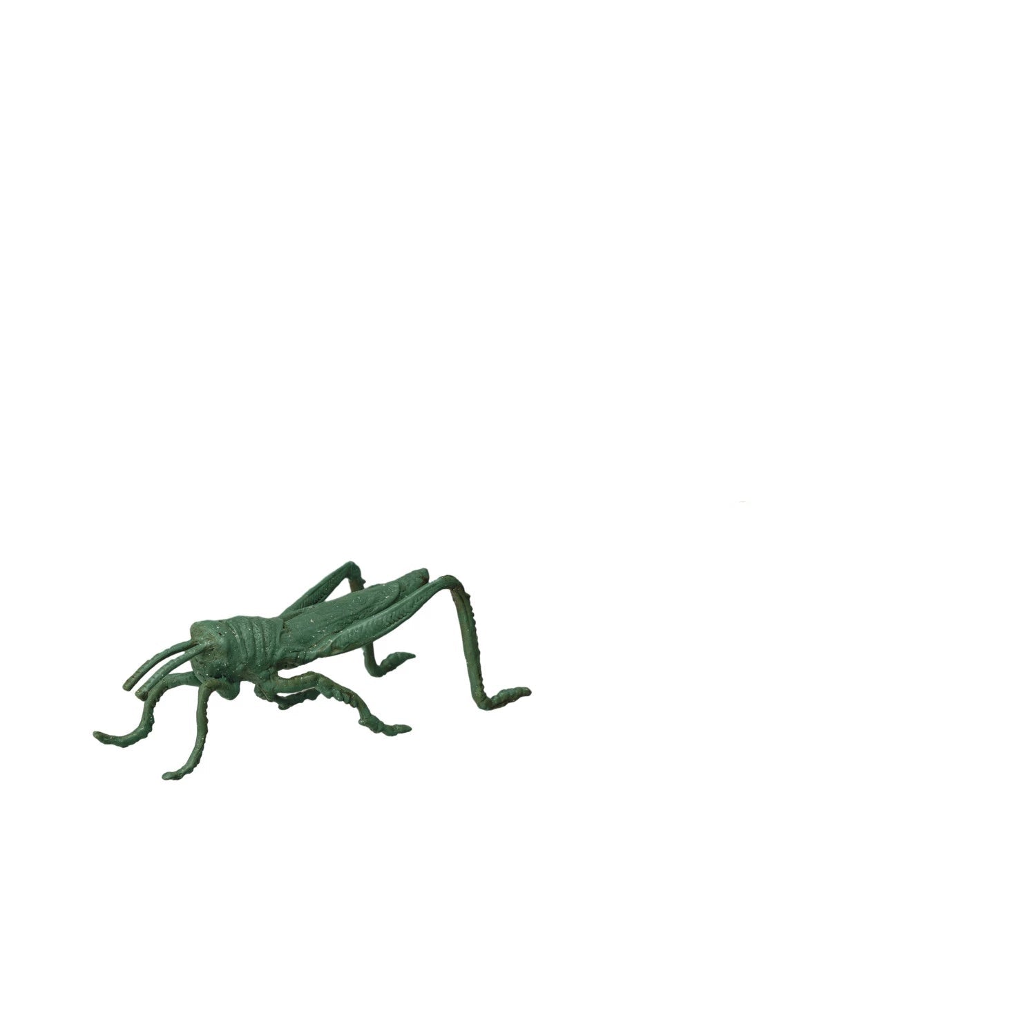 green metal grasshopper on a white background