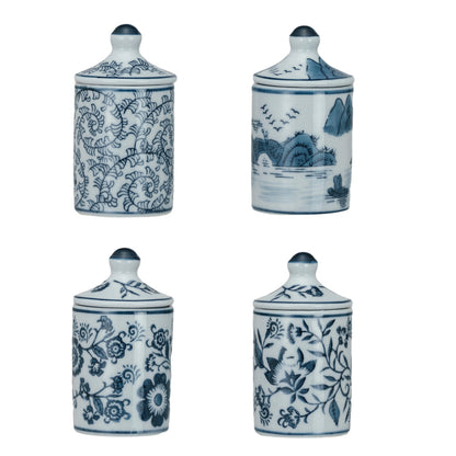 4 assorted blue and white patterned jars on a white background.