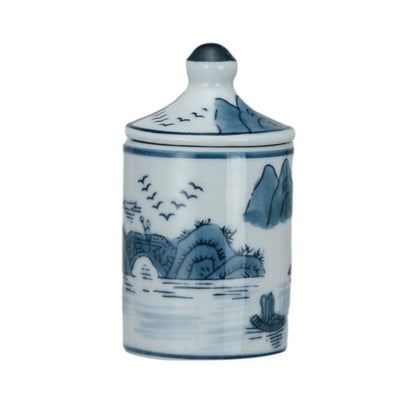 white jar with blue mountain scenery pattern.