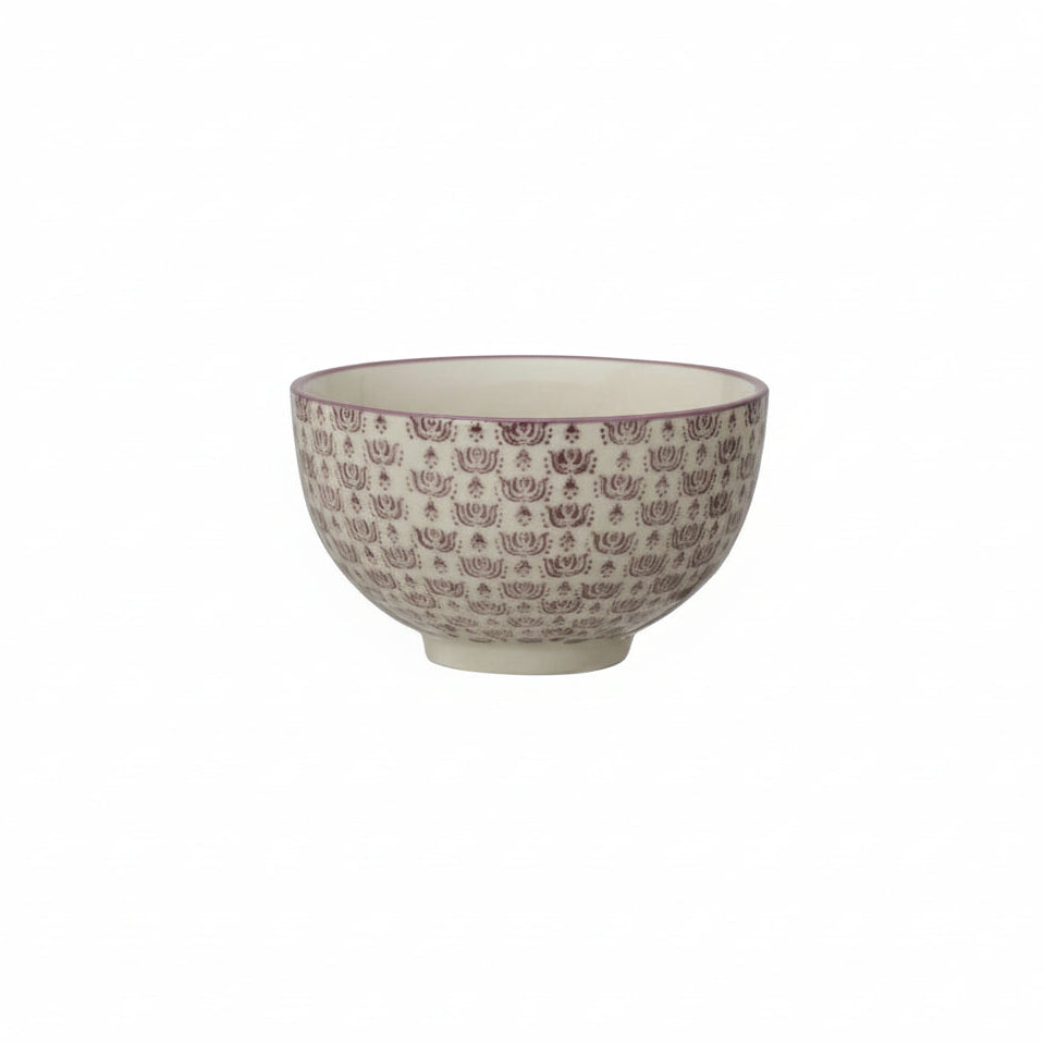 Ceramic bowl with decorative purple pattern on a white background
